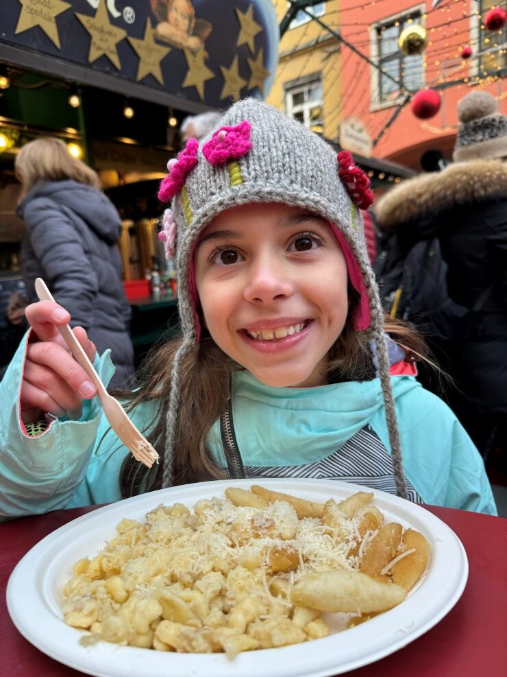 Kasespaetzle and Tyrolean noodles at the Christmas market in Innsbruck, Austria