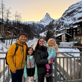 Family photo with Matterhorn on the river bridge in Zermatt Switzerland