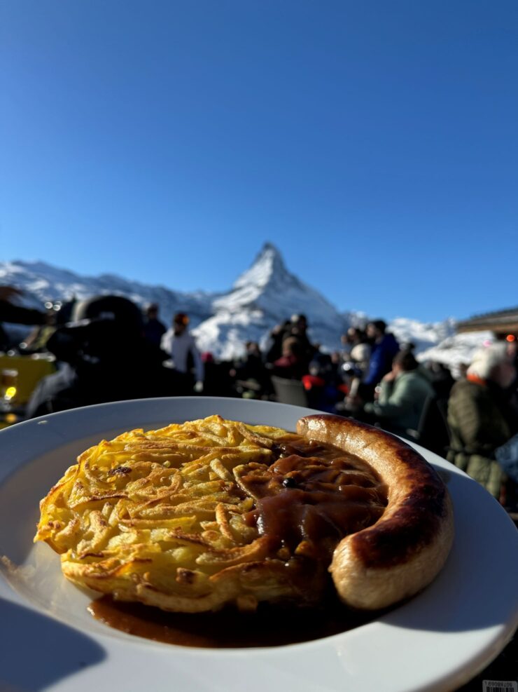 Bratwurst and rosti potatoes at Sunnegga Lodge on ski slopes of Zermatt Switzerland Matterhorn