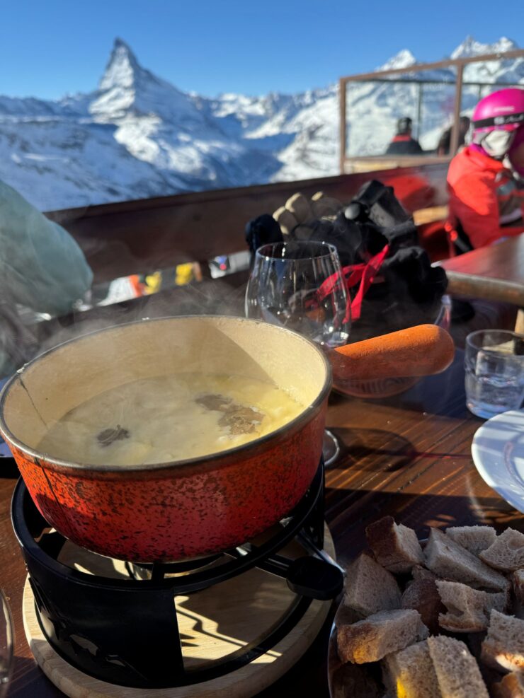 Truffle fondue at Fluhalp restaurant on the ski slopes of Zermatt Matterhorn Switzerland