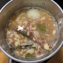 cooking white beans with rosemary and bacon.