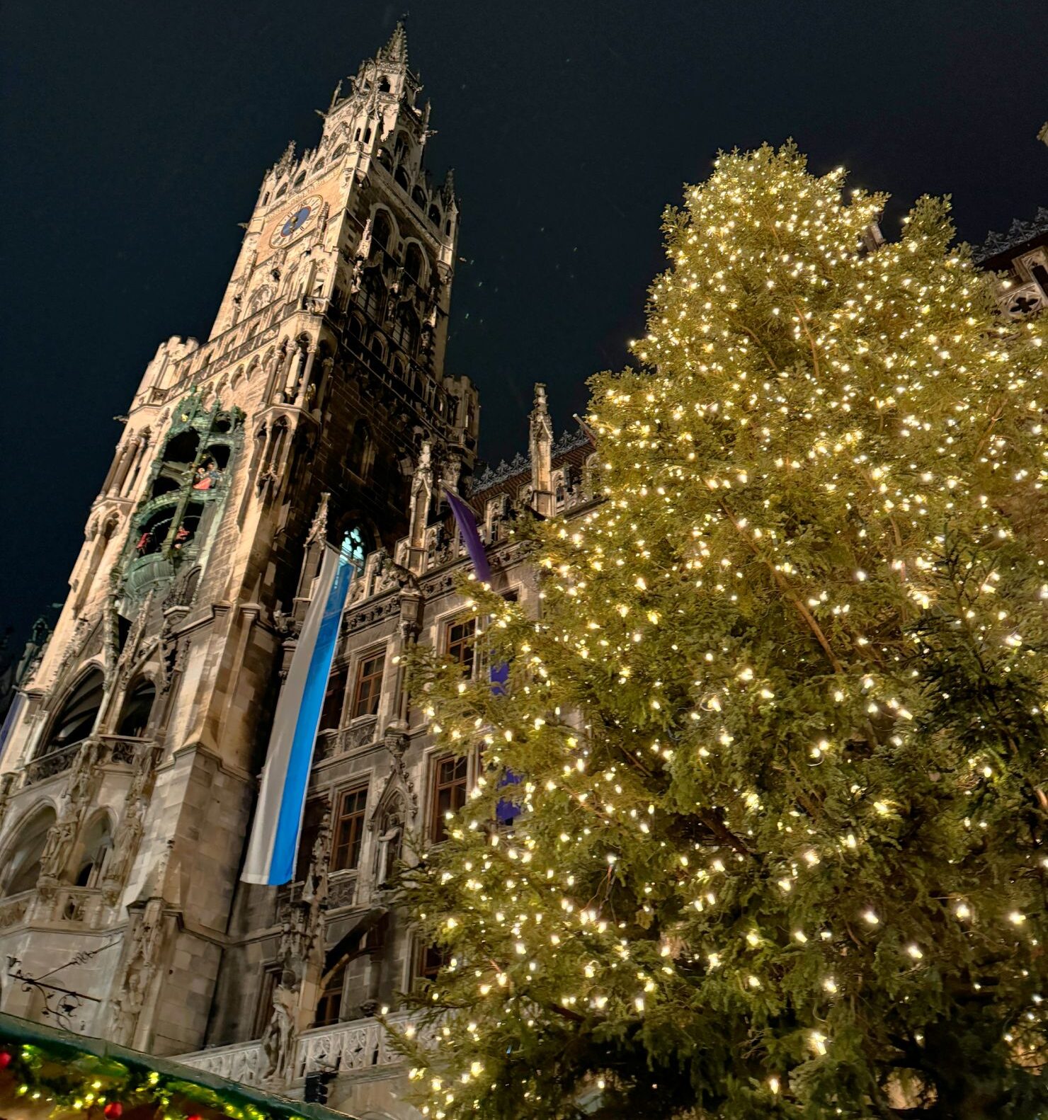 Marienplatz Christmas market next to the Christmas tree in December in Munich, Germany