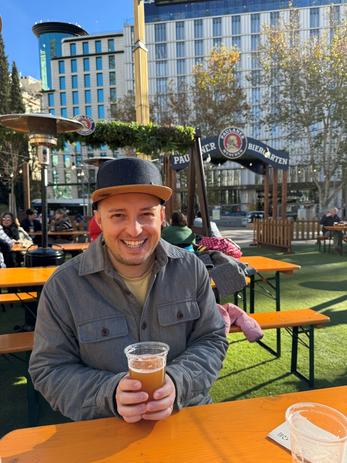 Enjoying the biergarten in the Plaza de Espana Christmas market in Madrid, Spain