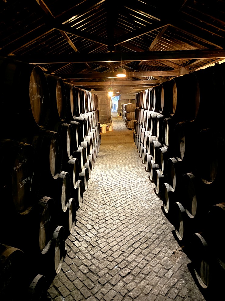 Wine barrels in the cellars at Ferreira Port Wine Cellars in Cais de Gaia and exploring Porto, Portugal