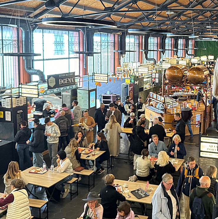 Visitors eating at Mercado Beira-Rio in Cais de Gaia and exploring Porto, Portugal