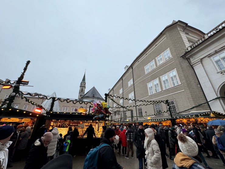 Winter family fun in Salzburg visiting the Residenzplatz Christmas market in Salzburg, Austria