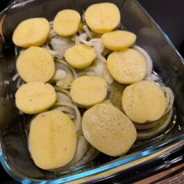 Preparing garlic wine roasted potatoes a perfect side dish.