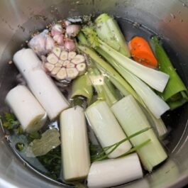 Ingredients in a pot with water for the ultimate homemade chicken stock