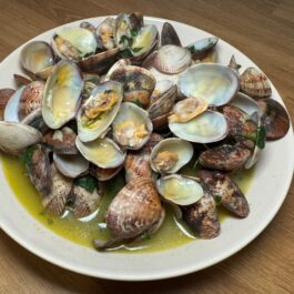 Steamed clams in garlic cilantro white wine sauce; Portuguese Bulhao Pato