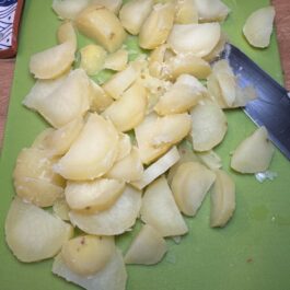 After cooking the potatoes they are cut up for Tortilla Espanola