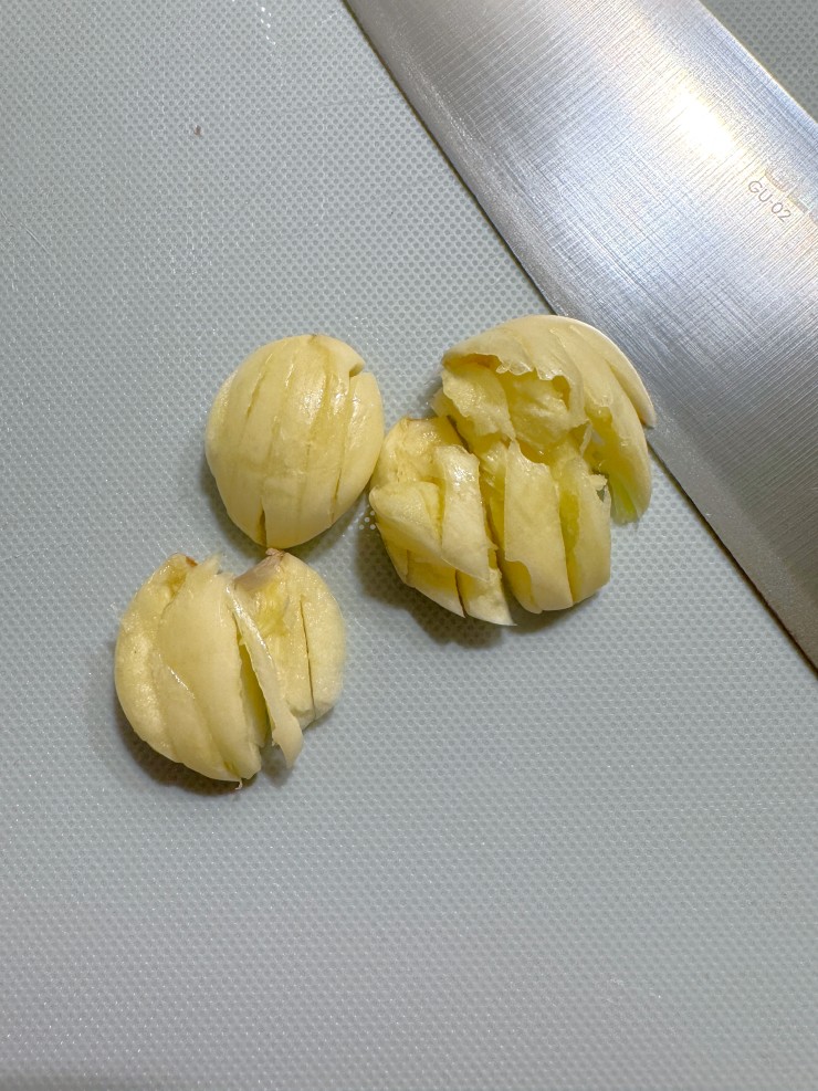 Slicing garlic with a lattice for the Easiest Way to Cut garlic into a small dice