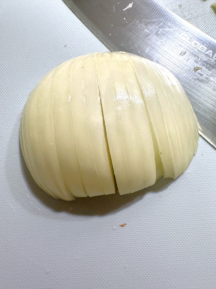 Slicing onion with a lattice for the Easiest Way to Cut Onions into a small dice