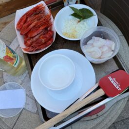 The first batch of ingredients ready for the paella pan on the grill.