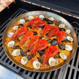 Once the rice is cooked the scarlet shrimp (carabineros) and clams are added on top of the seafood paella ready to serve.